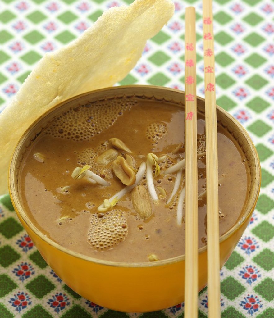 Peanut soup with bean sprouts and prawn crackers