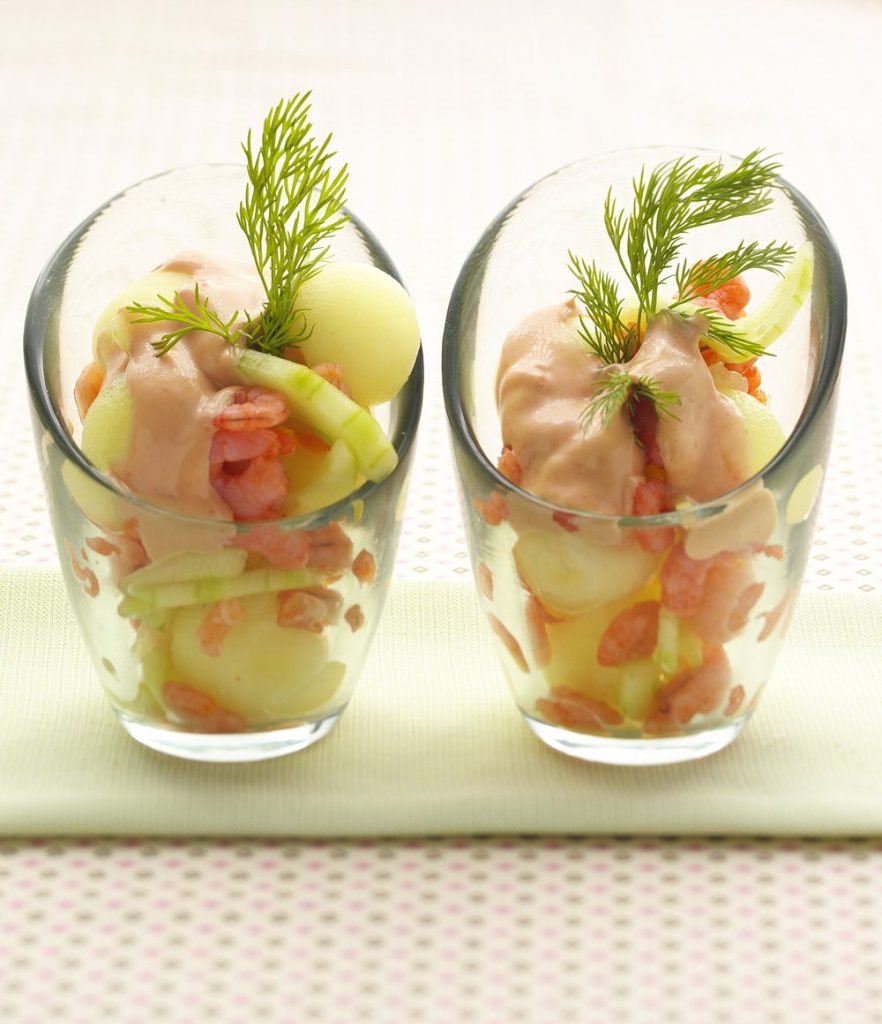 Prawn cocktail with melon and cucumber in glasses
